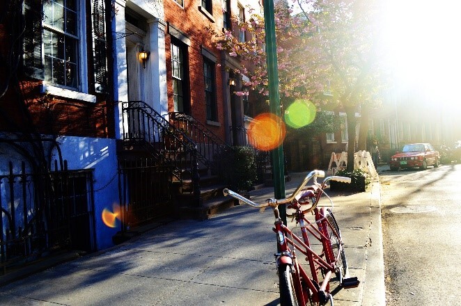 Neighborhood with bike on sidewalk