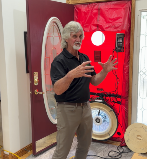 Dave explaining with Blower Door behind