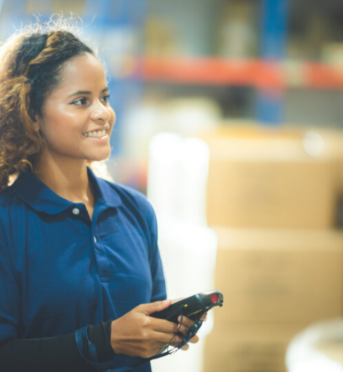 Young salesperson in warehouse with scanner Adobe Stock 367880914
