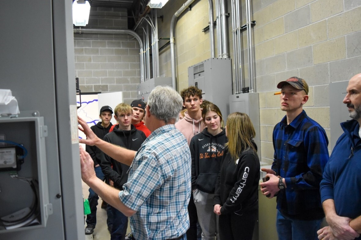 Students touring their school’s mechanical room.
