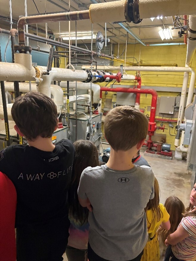 Two students with an e-gauge