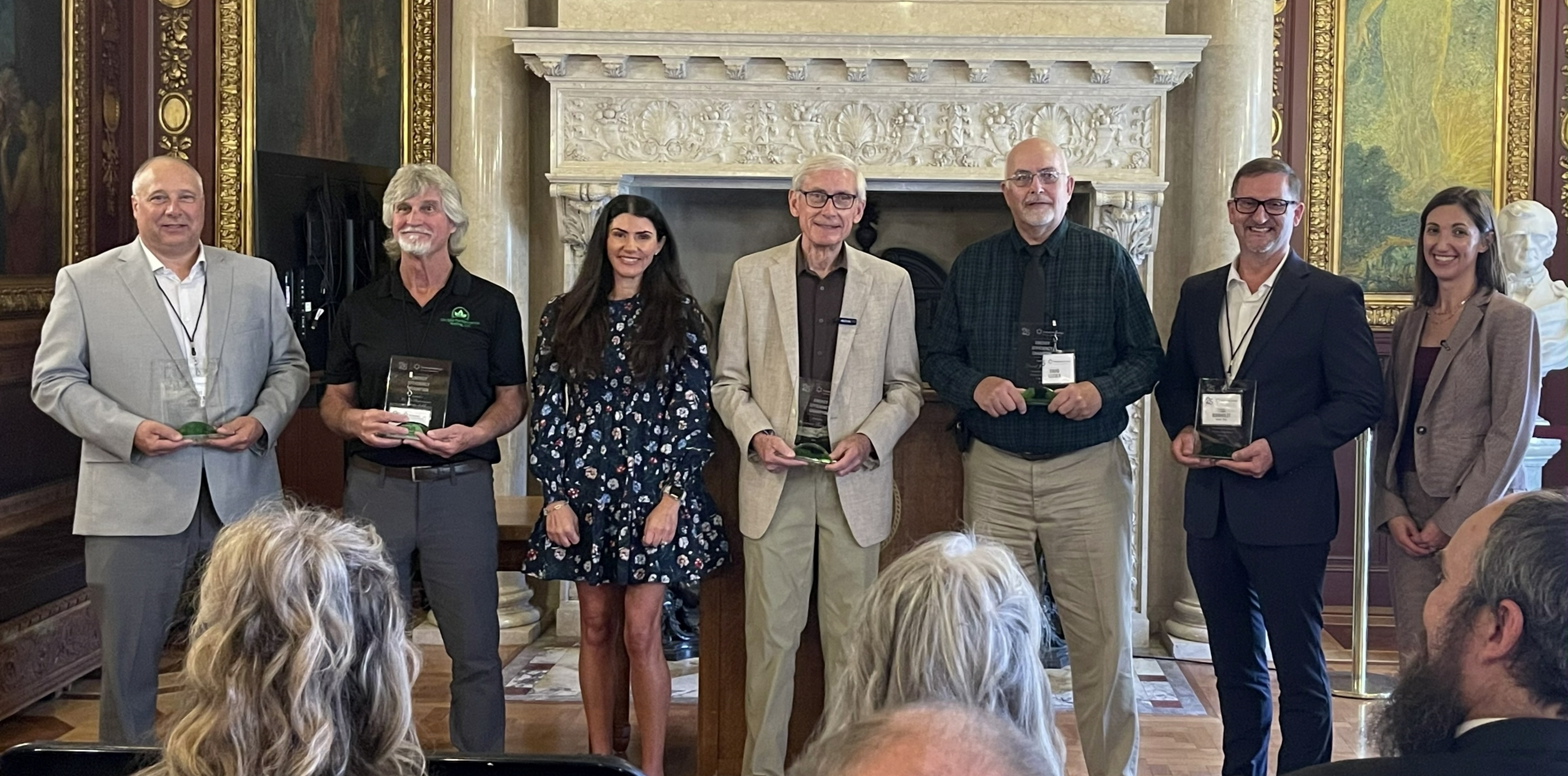 Four Energy Efficiency Champions, Gov. Evers, Summer Strand Chairperson, Public Service Commission of WI, and Erin SOman, Managing Director of Focus on Energy