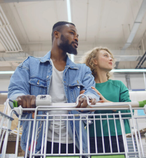 Couple Steering Grocery Cart